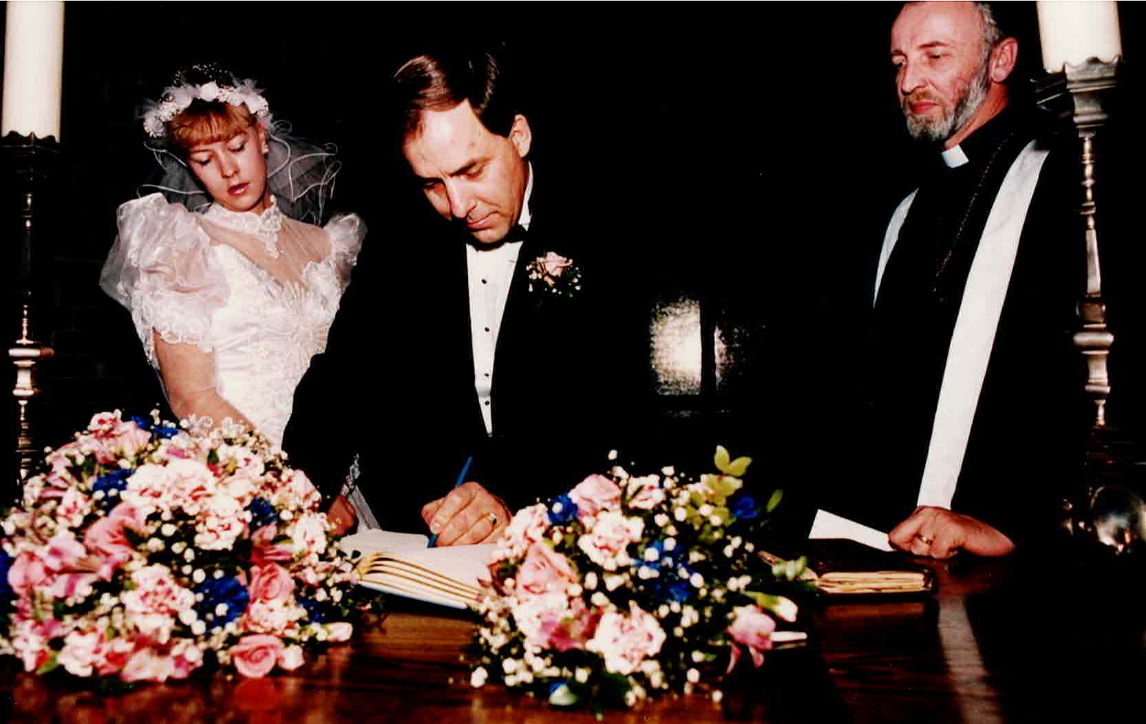 Signing the register, August 4, 1990