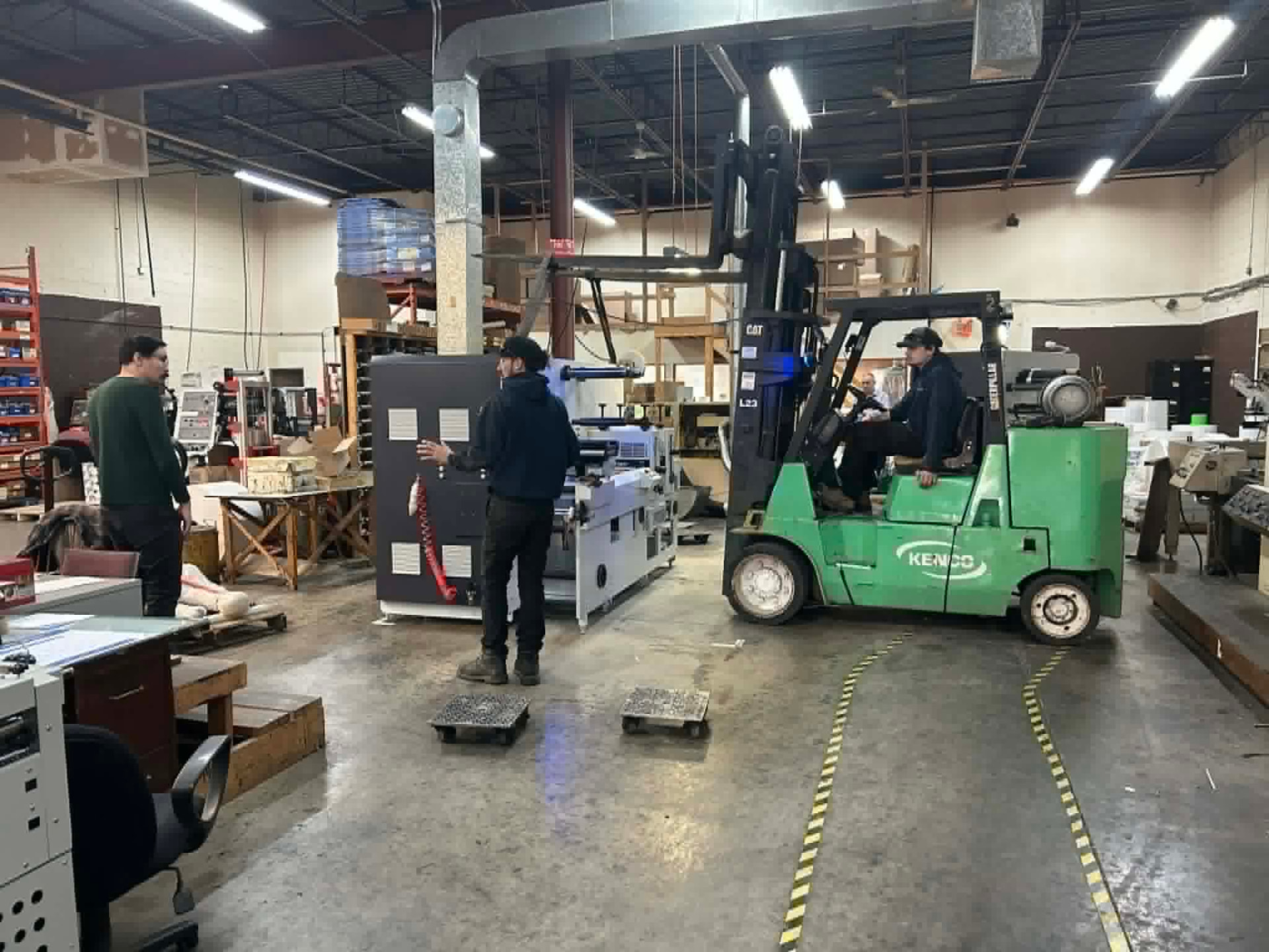 The ICC plant floor with staff and a forklift